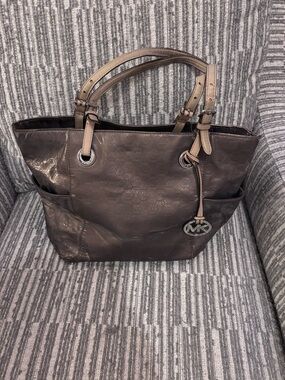 Michael Kors Jet Set East/West Signature Tote in a Metallic Finish